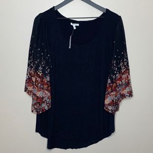 Black Maurice’s tshirt with floral sleeves